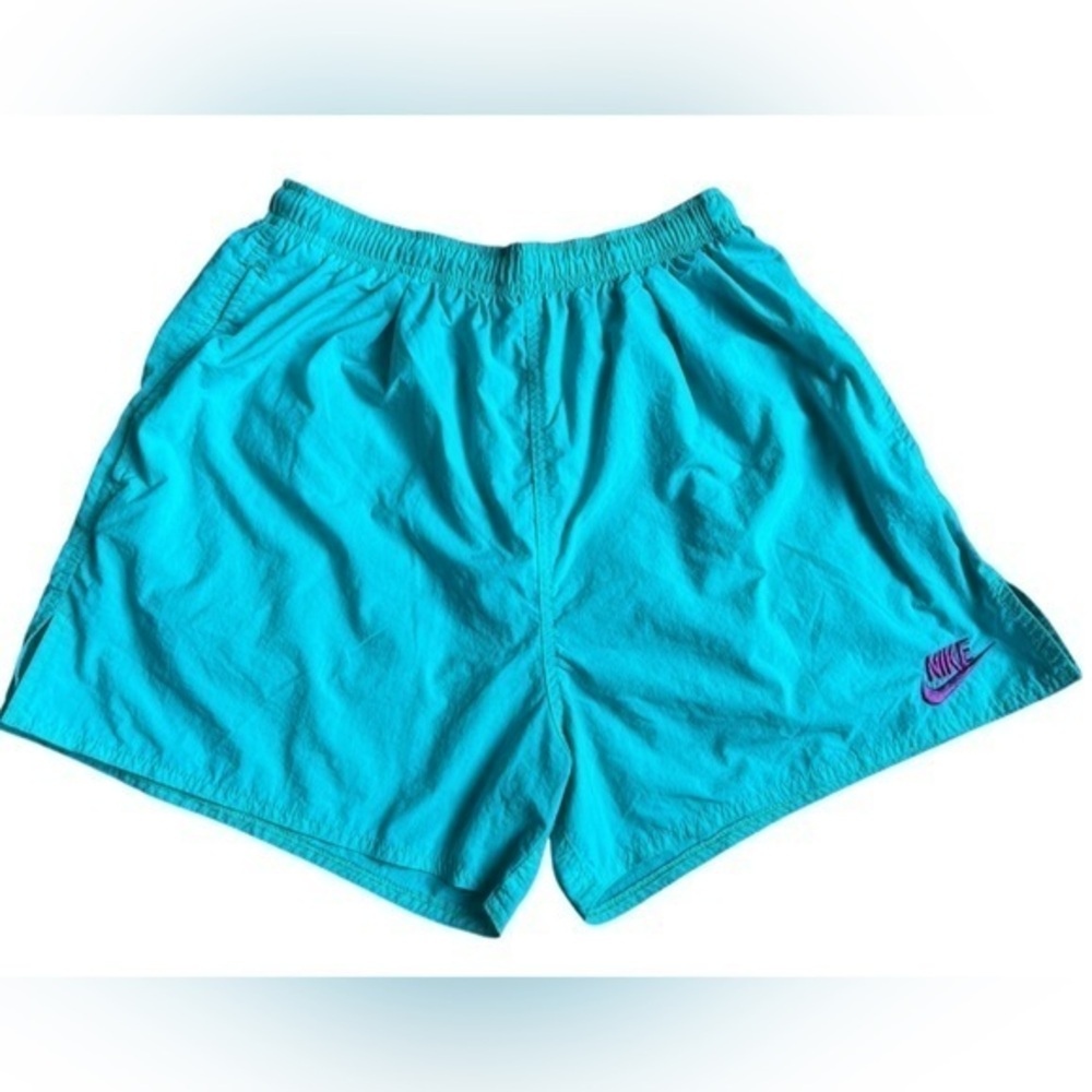 Nike women’s teal nylon short size medium.